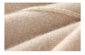 Women’s merino wool wide-leg trousers by FJØRNA featuring high waist and relaxed fit, shown in a natural beige color.