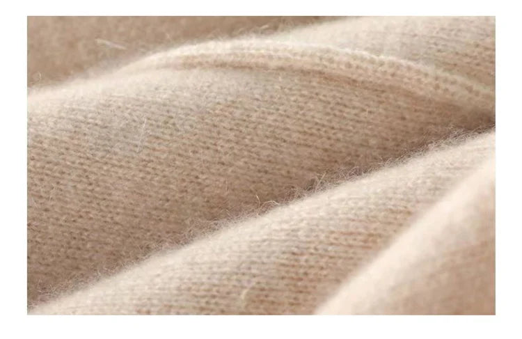 Women’s merino wool wide-leg trousers by FJØRNA featuring high waist and relaxed fit, shown in a natural beige color.