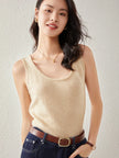 FJØRNA women's cashmere top, soft and cozy, featuring a relaxed fit and classic design, shown in a neutral color.