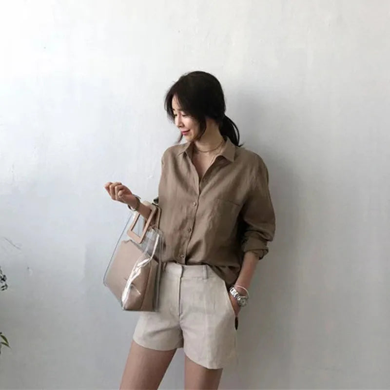 FJØRNA women's linen shirt with open collar, lightweight and breathable top, displayed on a neutral background.