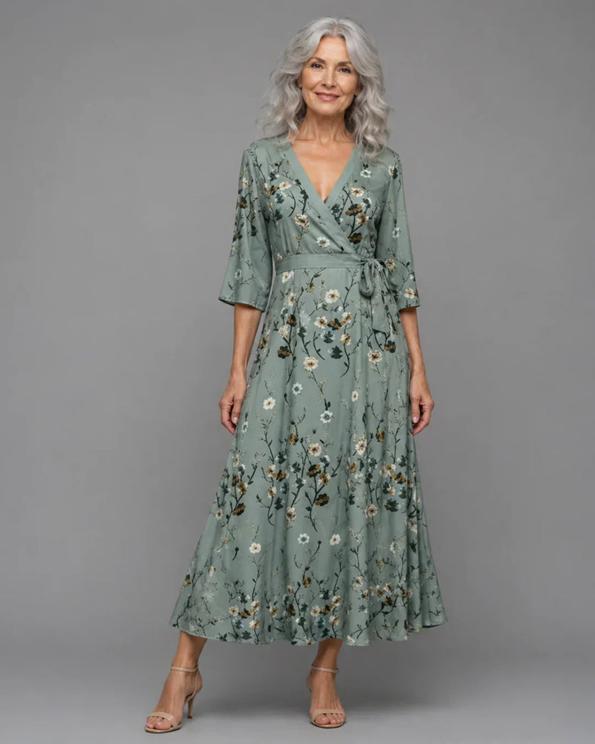 FJØRNA women's floral halter neck sleeveless maxi dress, elegant and flowing with vibrant bloom pattern and halter design.