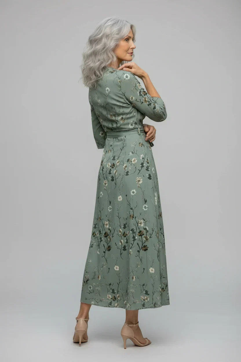 FJØRNA elegant floral maxi dress for women with halter neck and sleeveless design, perfect for summer or special occasions.