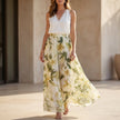 FJØRNA seaside halter top and flowing palazzo pants resort set, showcasing a stylish two-piece summer outfit with a halter neckline and breezy pants.