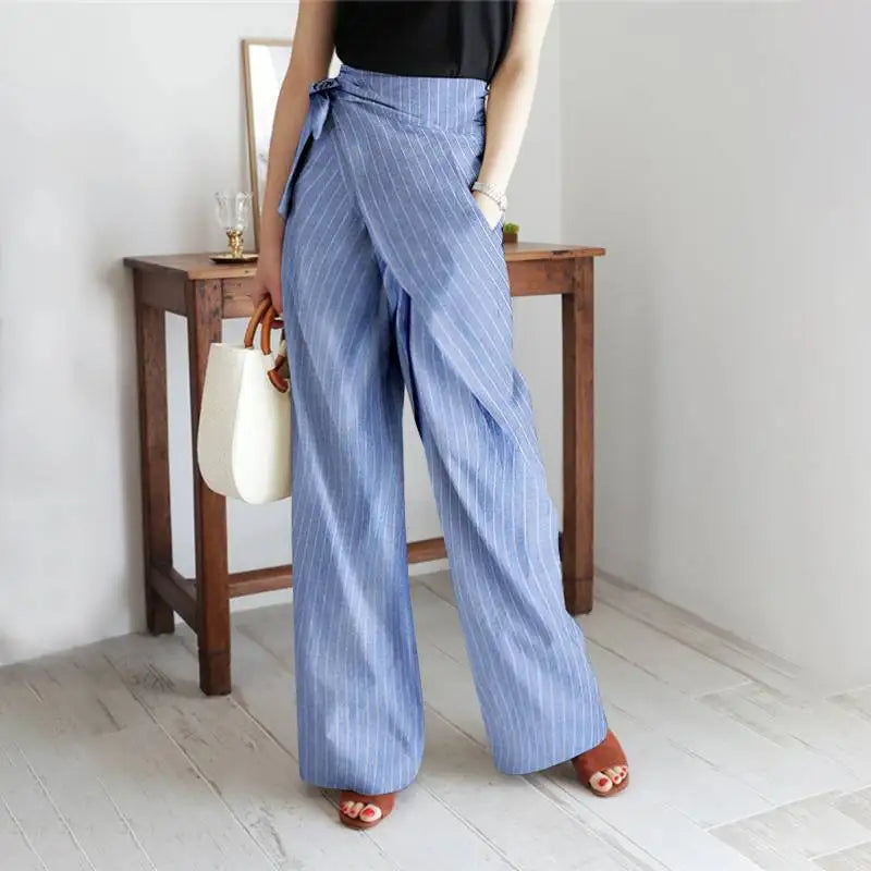 FJØRNA women's cotton wide-leg high-waist trousers, light-colored, tailored fit, and casual style, shown on a mannequin.