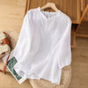 FJØRNA women's floral summer blouse with V-neck and ruffle accents, made of lightweight linen fabric, perfect for warm weather.
