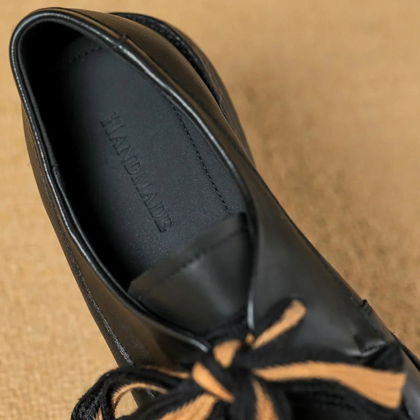 Handcrafted women's leather loafers by FJØRNA featuring cushioned soles and classic slip-on design.