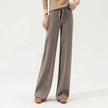 FJØRNA women's merino wool wide-leg high-waist trousers with a relaxed fit and tailored design, perfect for stylish comfort.