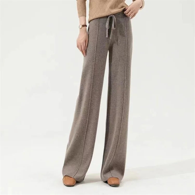 FJØRNA women's merino wool wide-leg high-waist trousers with a relaxed fit and tailored design, perfect for stylish comfort.