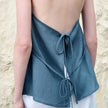 FJØRNA women's linen halter neck sleeveless waistcoat top, lightweight and stylish for warm weather, shown in natural fabric detail.