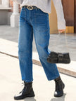 Women’s FJØRNA denim jeans with a stylish barrel leg cut, showcasing classic blue denim and relaxed fit.