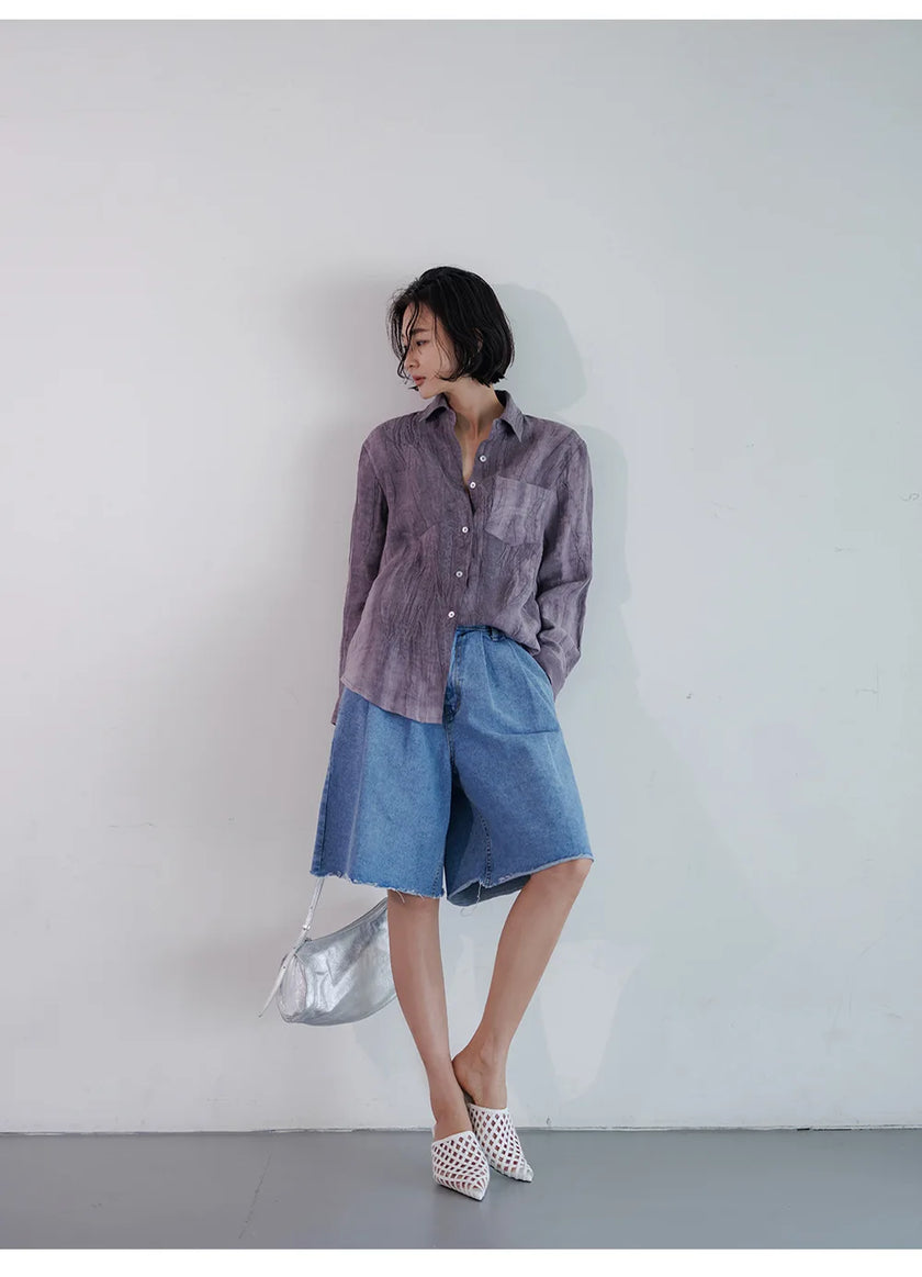 FJØRNA women's linen shirt with pleats, stylish long-sleeve top featuring a relaxed fit and natural fabric texture.