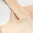 FJØRNA square neck linen cropped tank top displayed on a mannequin, showcasing its stylish design and lightweight fabric.