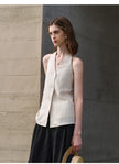 FJØRNA linen waistcoat for women with halter neck and sleeveless design, stylish top perfect for warm weather.