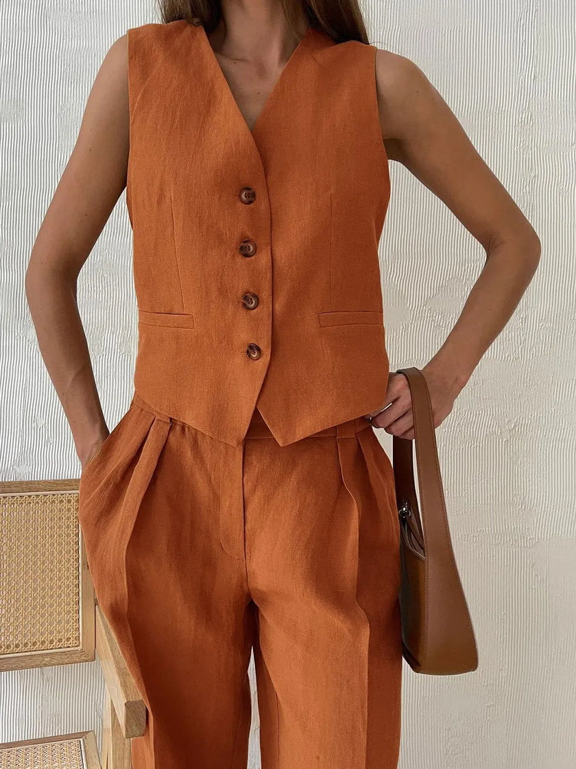 Women’s linen wide leg trousers from FJØRNA, part of a co-ord set, shown in natural beige fabric, relaxed fit and tailored design