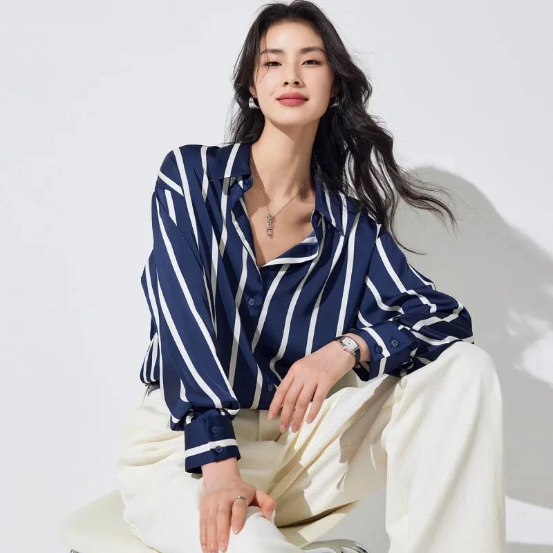 Lacceti Maren Stripe Satin Blouse featuring a stylish striped pattern and satin fabric, displayed on a hanger.