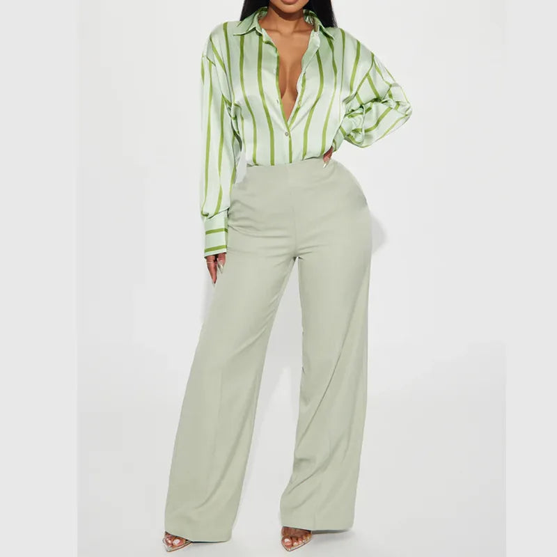 FJØRNA satin blouse for women, stylish women's top with a smooth, shiny fabric and elegant design.