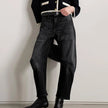 FJØRNA women's denim jeans with a barrel leg fit, showcasing classic blue denim with a relaxed, stylish silhouette.