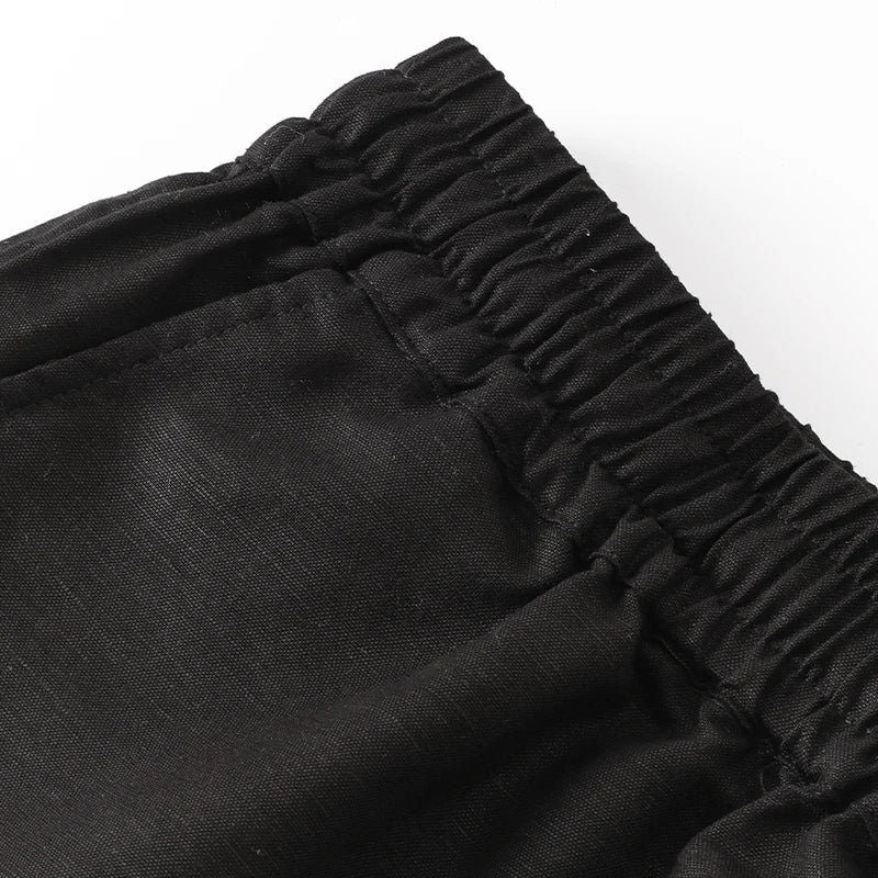 FJØRNA women's cotton linen wide leg trousers with drawstring, pull-on style, featuring a relaxed fit and casual chic design.