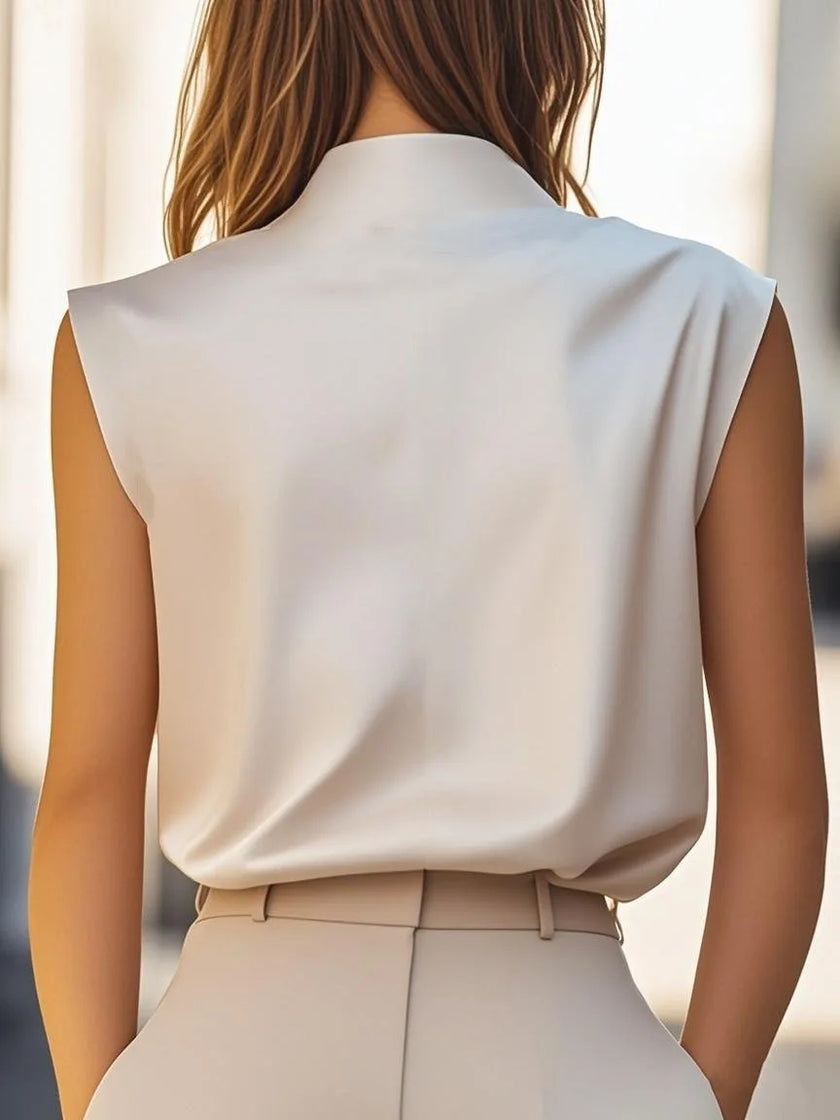 FJØRNA women's high-neck sleeveless summer blouse, lightweight top with elegant design, shown in a soft fabric.