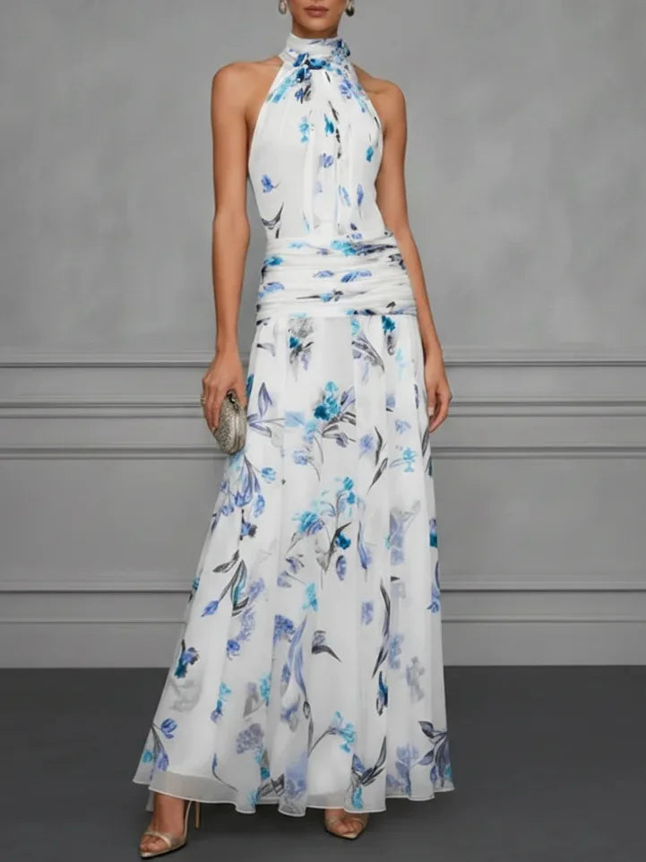 Jasmine floral halter wedding guest dress by FJØRNA, featuring a flowy silhouette and delicate floral pattern.