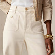 Women’s wide-leg cotton jeans by FJØRNA, high-waist pants with a relaxed fit, shown on a model.