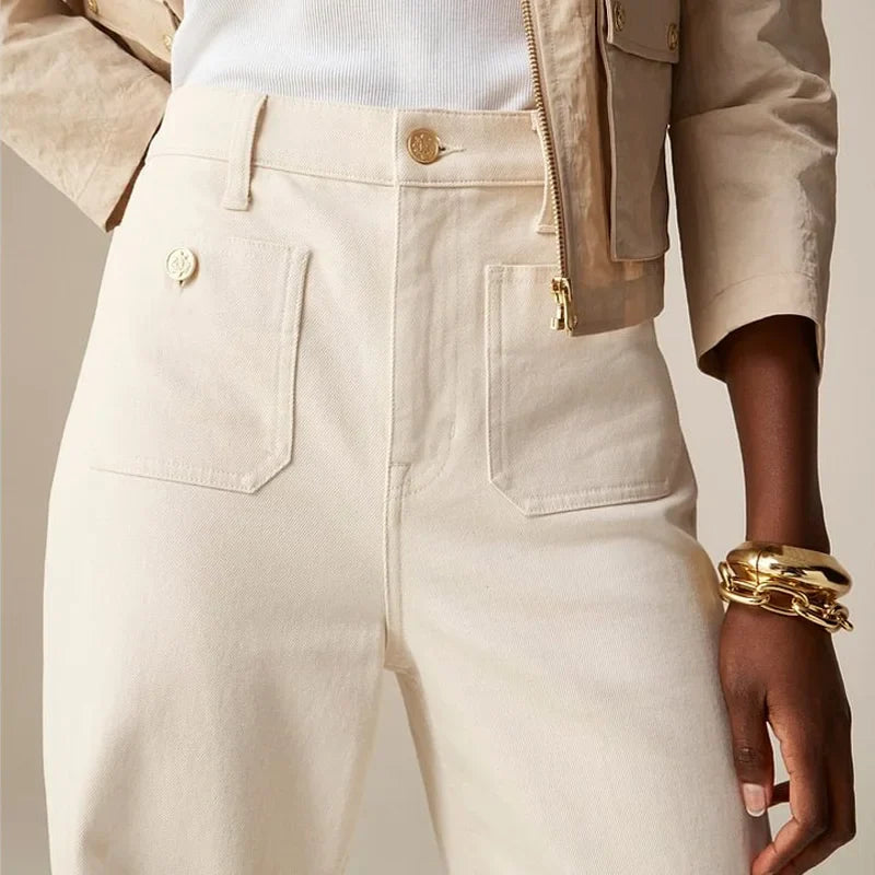 Women’s wide-leg cotton jeans by FJØRNA, high-waist pants with a relaxed fit, shown on a model.