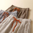 FJØRNA linen wide-leg women's trousers with drawstring waist, lightweight and comfortable for casual or stylish wear.