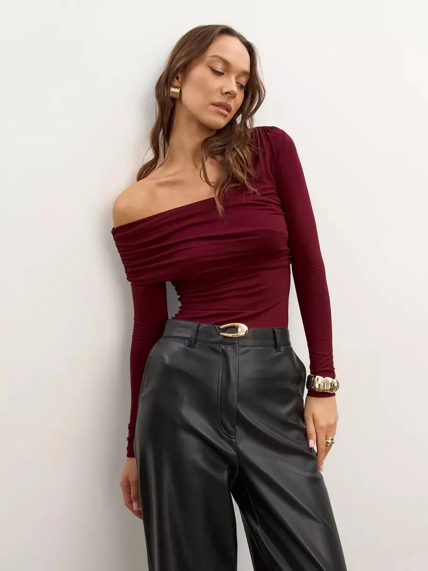 Women’s off-shoulder cotton top by FJØRNA, featuring a casual fit and stylish neckline, shown in a light fabric with a relaxed design.