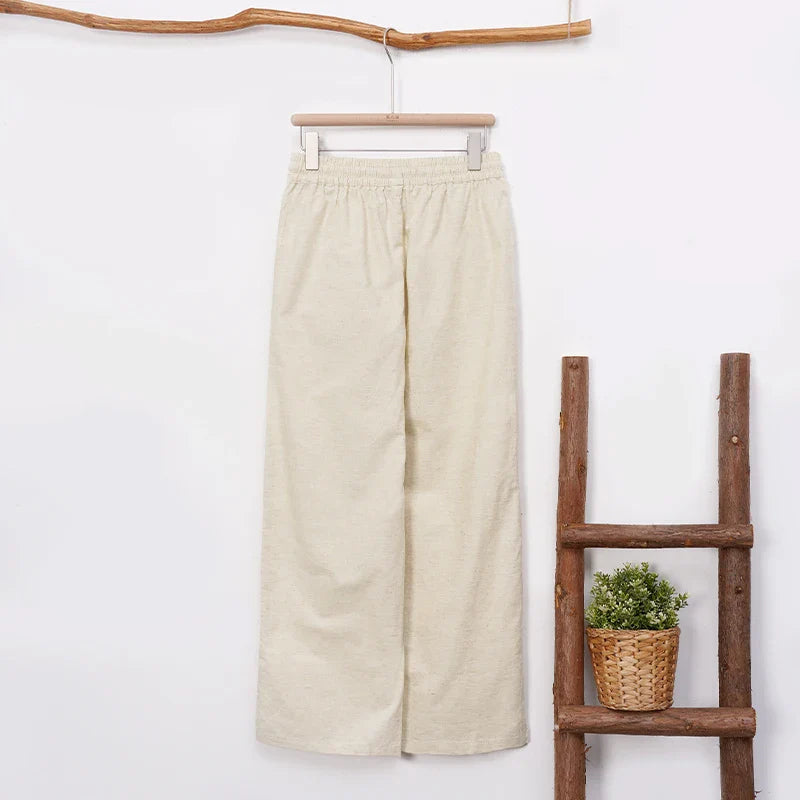 FJØRNA women's cotton linen wide-leg trousers with drawstring waist, pull-on style, in neutral fabric for casual wear.