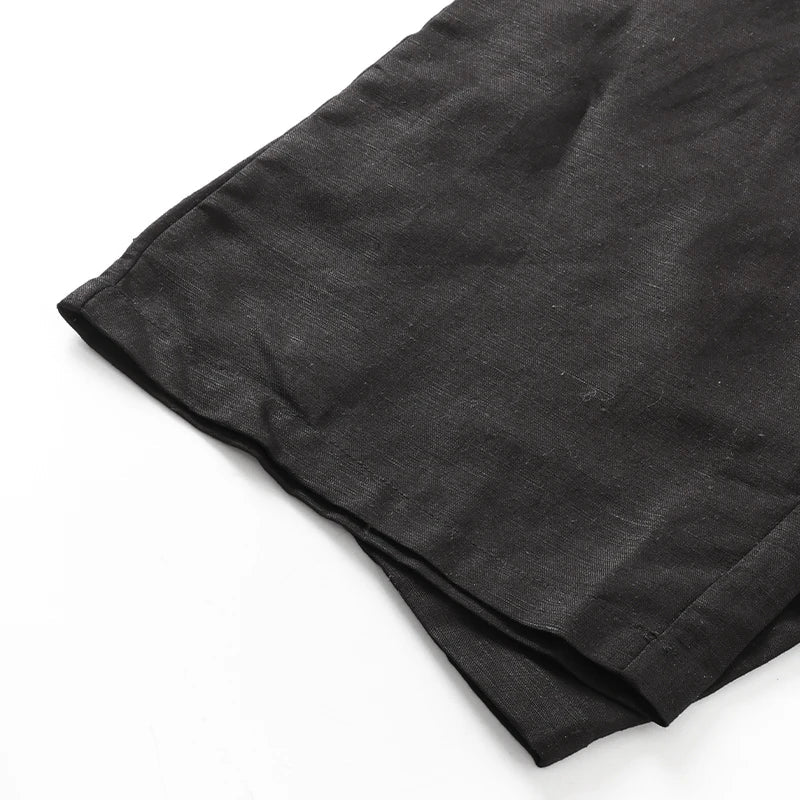 FJØRNA women's cotton linen wide leg trousers with drawstring pull-on design, relaxed fit, and lightweight fabric.