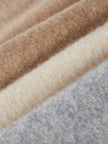 FJØRNA women's cashmere top, soft and cozy knit, featuring a classic crew neckline and long sleeves.