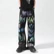 Black painted trousers by FJØRNA featuring a relaxed fit and stylish design, shown on a model.