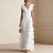 White Patricia Ruffle Trim Maxi Dress by FJØRNA, showcasing flowing fabric and elegant ruffle details perfect for summer wear.