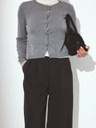 Soft knit cardigan for women by FJØRNA, showing a cozy, ribbed design in neutral tones, perfect for casual layered outfits.