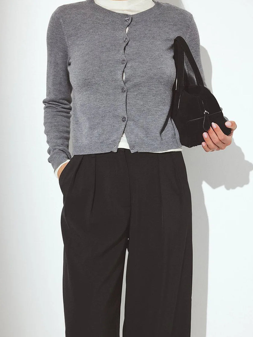 Soft knit cardigan for women by FJØRNA, showing a cozy, ribbed design in neutral tones, perfect for casual layered outfits.
