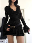 FJØRNA sheer lace mini dress featuring delicate floral lace and a fitted silhouette, perfect for elegant evening wear.