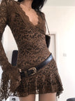 FJØRNA sheer lace mini dress featuring intricate lace details and a fitted silhouette, perfect for stylish evening wear.