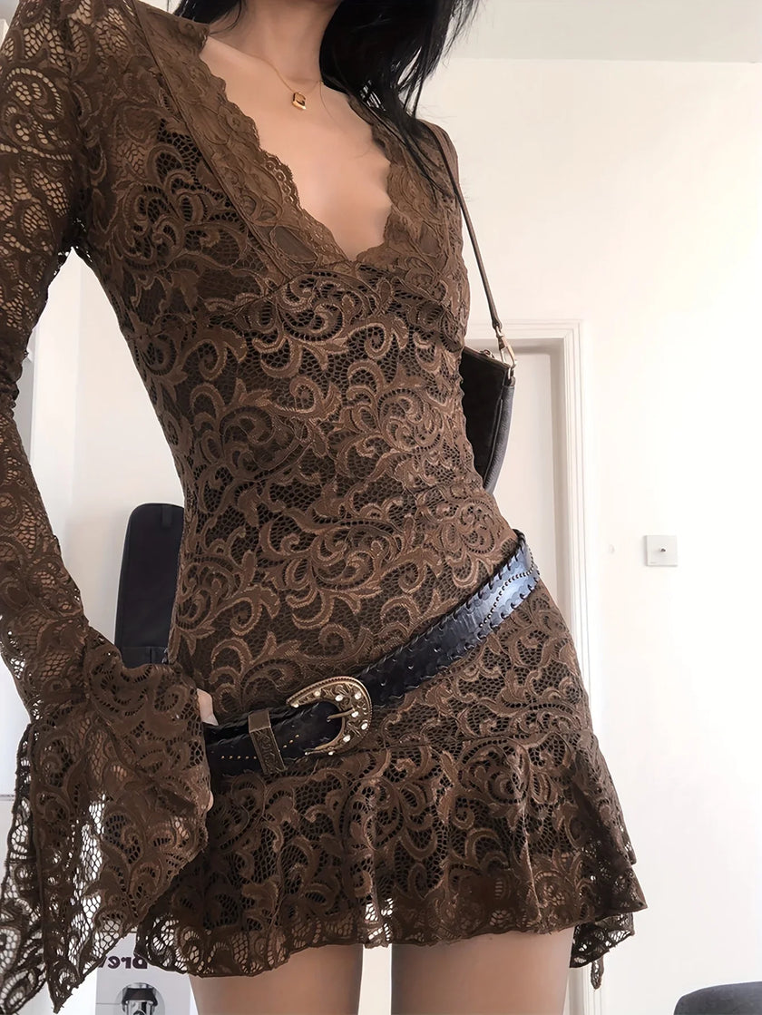 FJØRNA sheer lace mini dress featuring intricate lace details and a fitted silhouette, perfect for stylish evening wear.