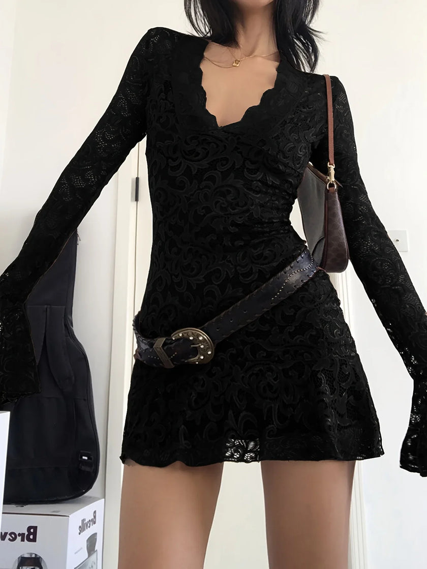FJØRNA sheer lace mini dress featuring intricate lace details and a fitted silhouette for a stylish evening look.