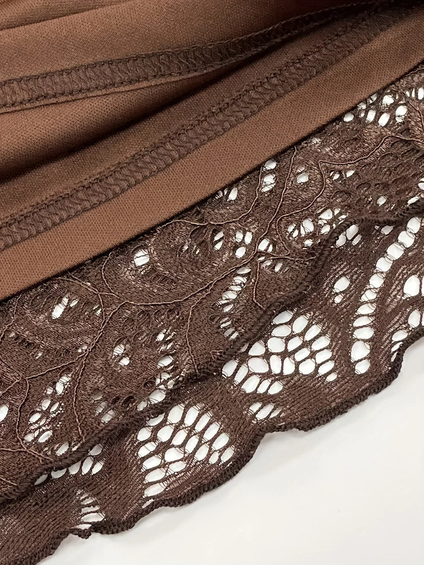 FJØRNA sheer lace mini dress featuring delicate lace fabric and a fitted silhouette, perfect for stylish evening wear.