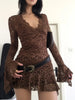 FJØRNA sheer lace mini dress featuring delicate floral lace fabric and a fitted silhouette, ideal for elegant evening wear.