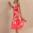 Side view of FJØRNA fitted one-shoulder maxi dress with mesh overlay and ruched detail, showcasing elegant design and silhouette.