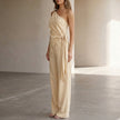 FJØRNA women's summer two-piece co-ord set with one-shoulder top and pockets, shown from side detail.