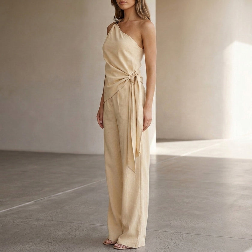 FJØRNA women's summer two-piece co-ord set with one-shoulder top and pockets, shown from side detail.