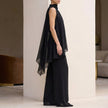 Side view of FJØRNA elegant women's two-piece chiffon pleated co-ord set, showcasing the flowing fabric and stylish design.
