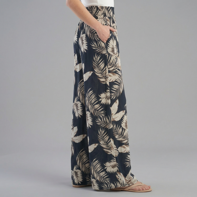 FJØRNA women's summer cotton trousers with ruched design, shown from the side view, lightweight and comfortable for warm weather.