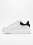FJØRNA men's white lace-up trainers with minimalist design, side profile view showcasing casual and versatile everyday shoes.