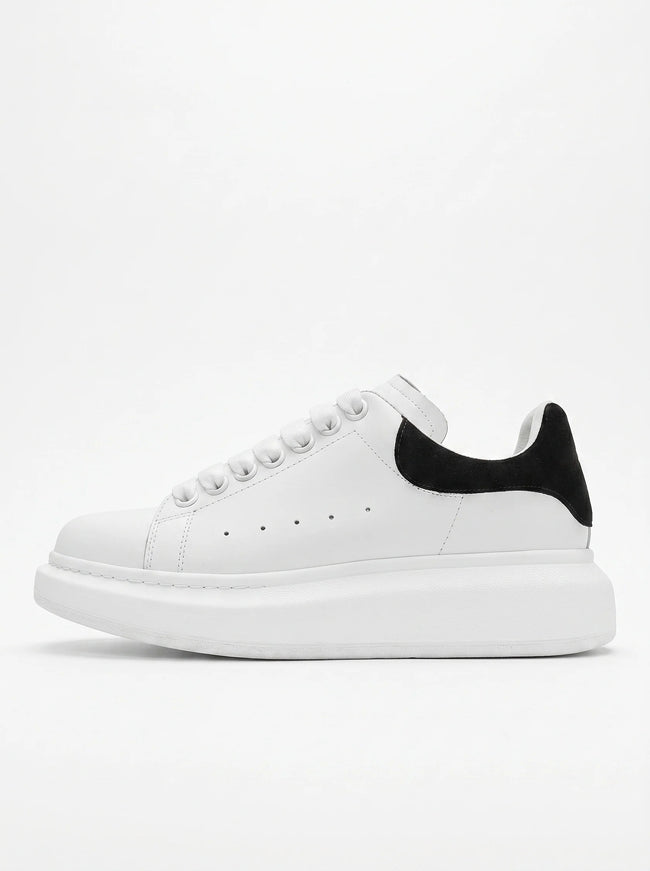 FJØRNA men's white lace-up trainers with minimalist design, side profile view showcasing casual and versatile everyday shoes.