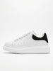 FJØRNA men's white lace-up trainers with minimalist design, side profile view showcasing casual and versatile everyday shoes.