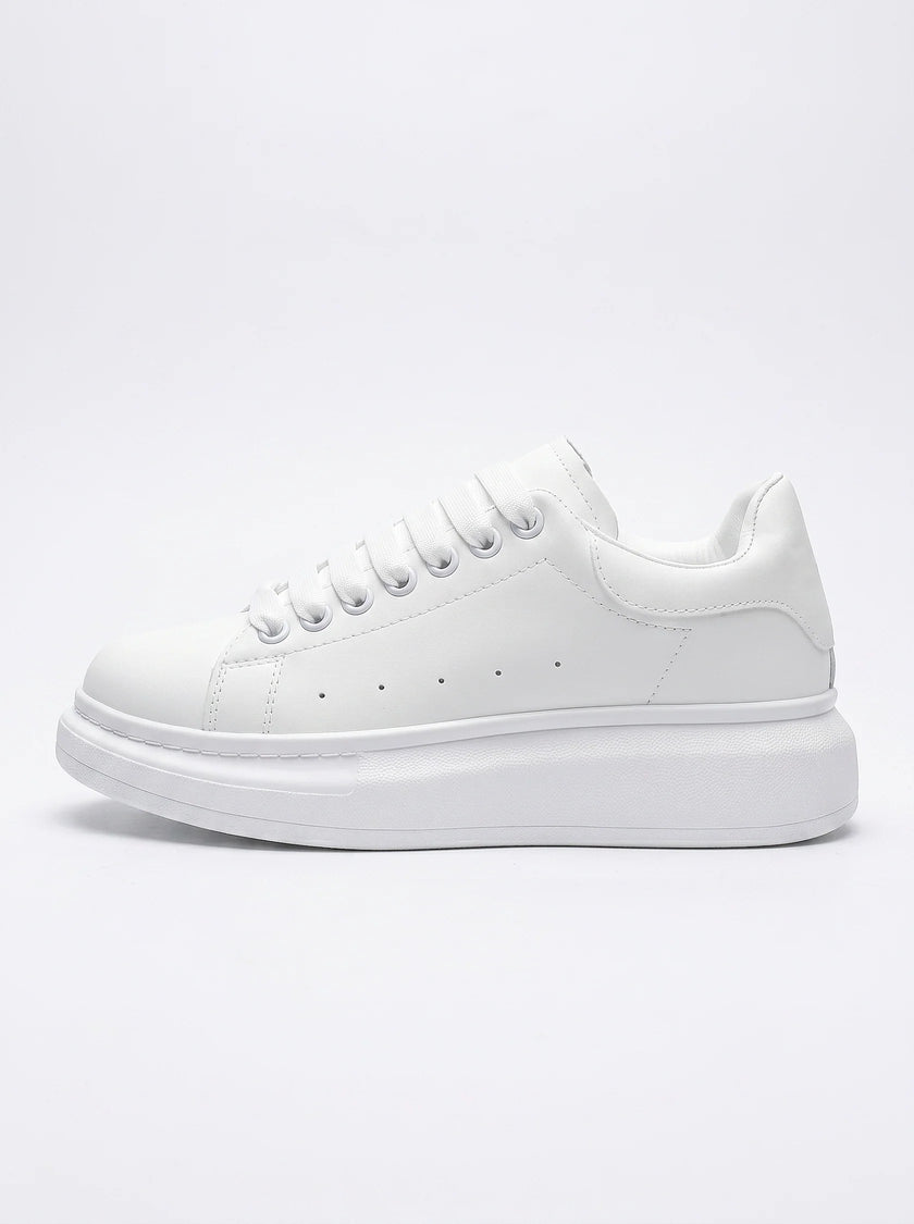 FJØRNA men's white lace-up trainers with minimalist design, side profile view showcasing sleek, casual everyday shoes for men.